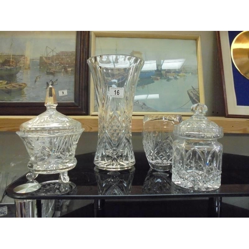 16 - Two cut glass vases, a cut glass biscuit jar and a moulded glass sugar bowl with lid, COLLECT ONLY.