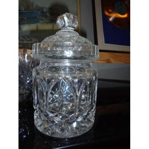 16 - Two cut glass vases, a cut glass biscuit jar and a moulded glass sugar bowl with lid, COLLECT ONLY.