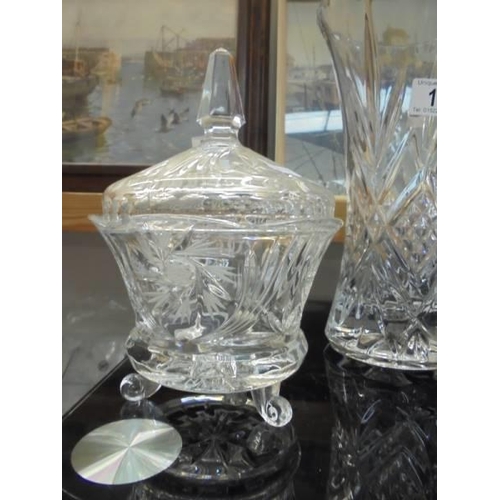 16 - Two cut glass vases, a cut glass biscuit jar and a moulded glass sugar bowl with lid, COLLECT ONLY.