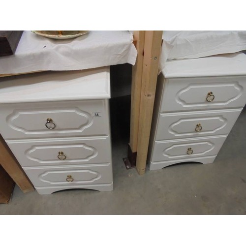 34 - A pair of white three drawer bedside chests, COLLECT ONLY.