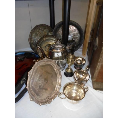 42 - A mixed lot of silver plate including trays, coffee pot, trophies etc.,