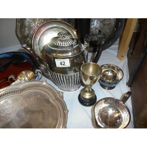 42 - A mixed lot of silver plate including trays, coffee pot, trophies etc.,