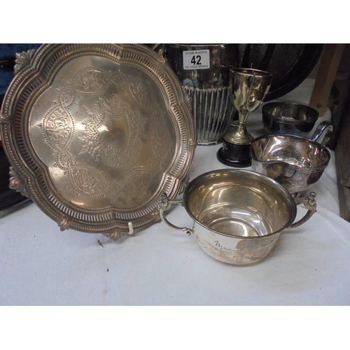 42 - A mixed lot of silver plate including trays, coffee pot, trophies etc.,