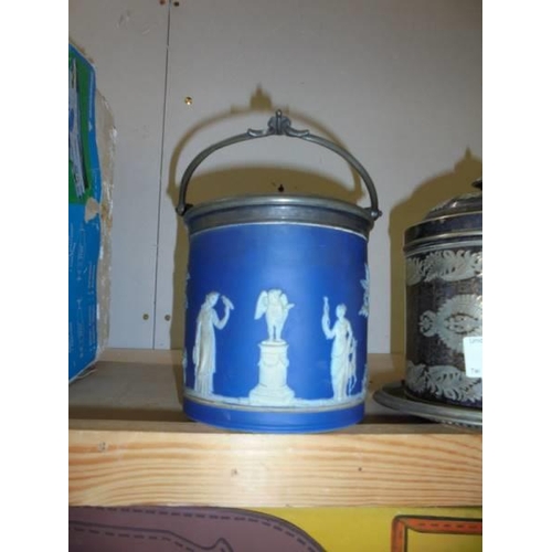 44 - A Jasper ware biscuit barrel and a silver plate biscuit barrel.