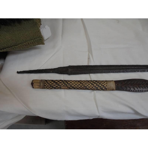 63 - A sword blade and a wooden tribal weapon.