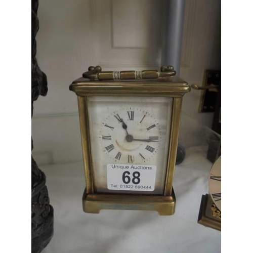 68 - A brass carriage clock and one other.