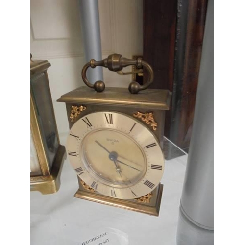 68 - A brass carriage clock and one other.