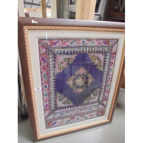 79 - A framed and glazed Asian embroidered panel. COLLECT ONLY.