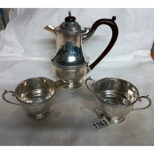 1163 - A silver coffee pot, sugar bowl and milk jug,