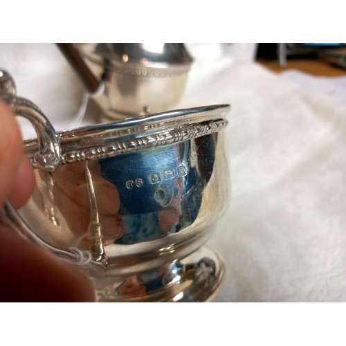 1163 - A silver coffee pot, sugar bowl and milk jug,