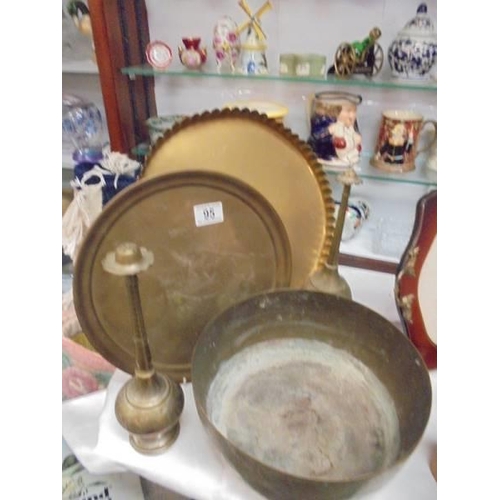 95 - Two brass trays, a brass bowl and two other items.