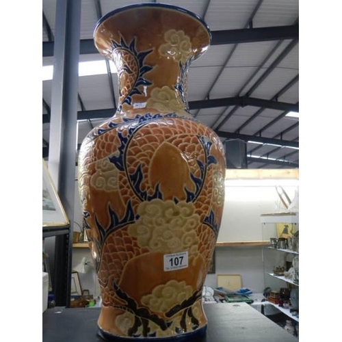 107 - A decorative pottery vase.