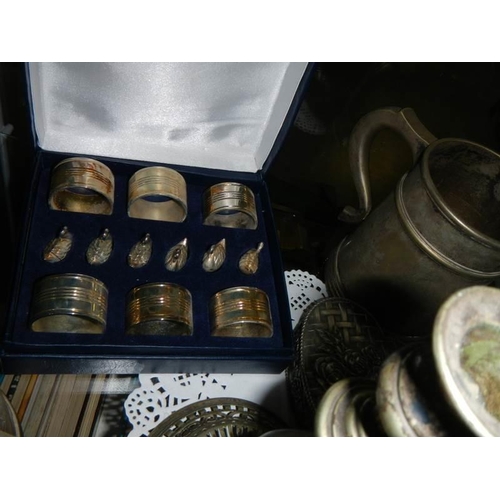 112 - A mixed lot including napkin rings, tankards, candlestick etc.,