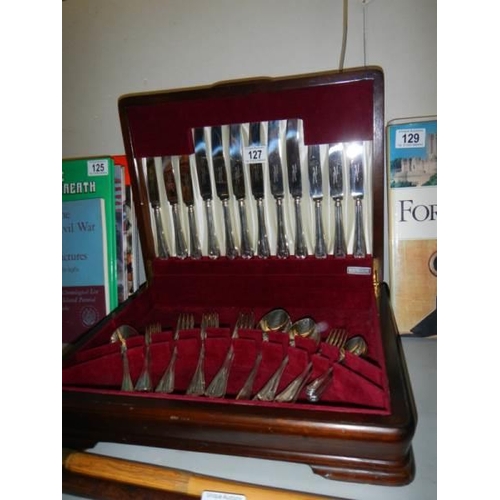 127 - A good quality mahogany cased canteen of cutlery.