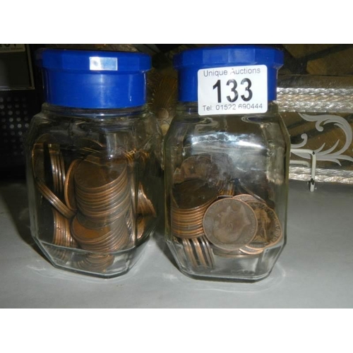 133 - Two jars of copper pennies.