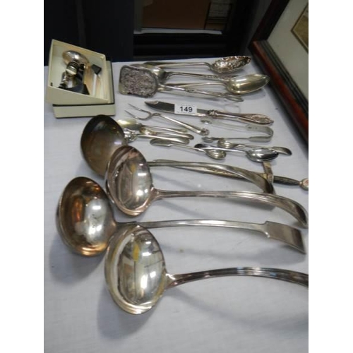 149 - Four silver plate soup ladles and other cutlery.