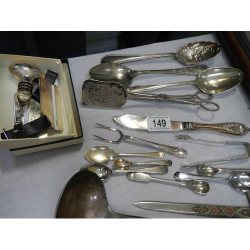 149 - Four silver plate soup ladles and other cutlery.