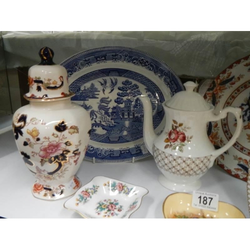 187 - A mixed lot including meat platter, plates, teapot, lidded jar etc., COLLECT ONLY.