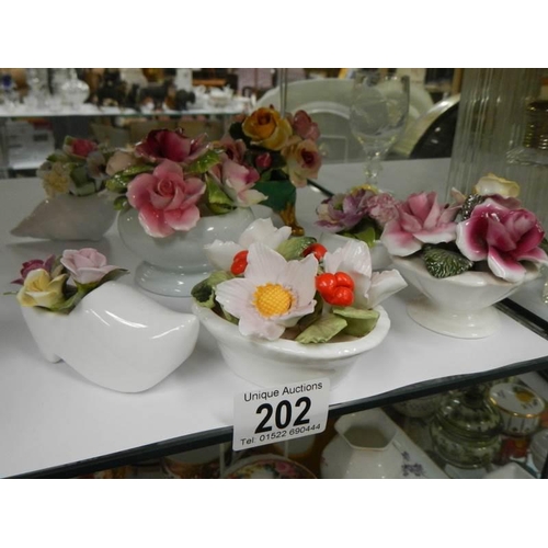 202 - A quantity of porcelain floral posies.