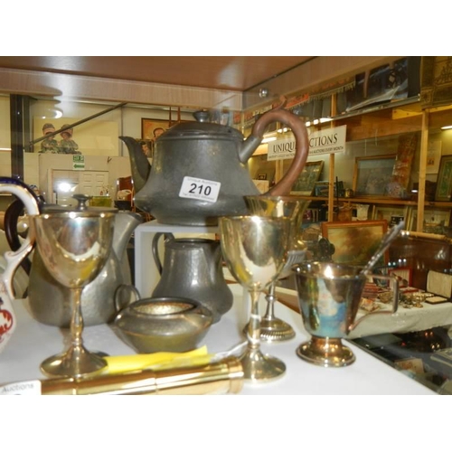 210 - A pewter tea set and other metal ware.