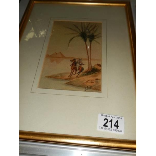 214 - A pair of framed and glazed Egyptian scenes, COLLECT ONLY.