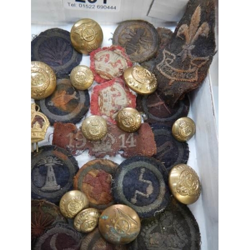 231 - A quantity of military badges and medals.