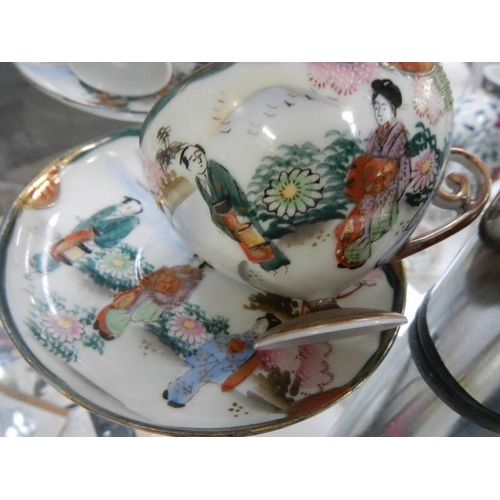 261 - Four Japanese porcelain tea cups and saucers.