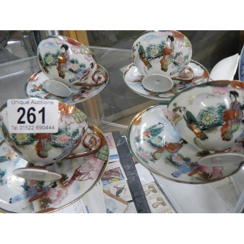 261 - Four Japanese porcelain tea cups and saucers.