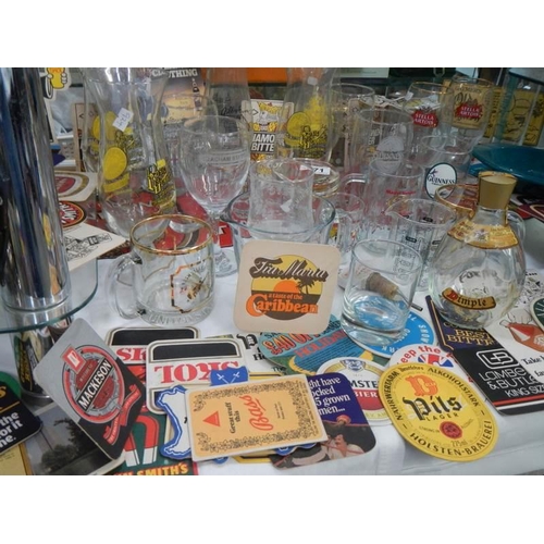 271 - A mixed lot of pub glasses and beer mats,. COLLECT ONLY.