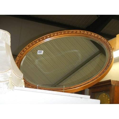 308 - An oval bevel edged mirror, COLLECT ONLY.