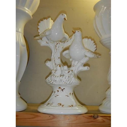 309 - Two white pottery jardiniere's on stands and a dove figure, COLLECT ONLY.