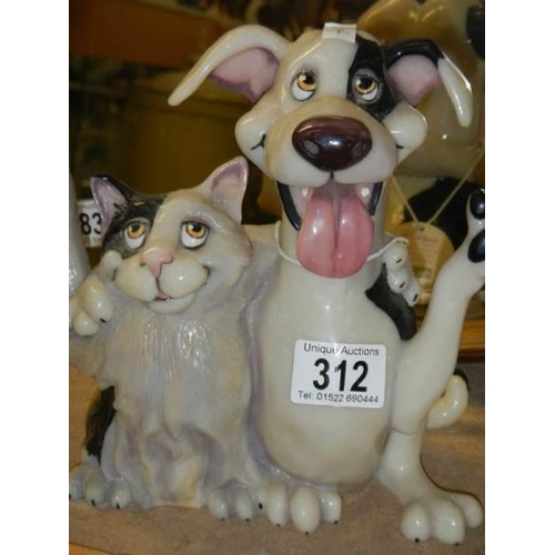 312 - A novelty cat and dog figure.