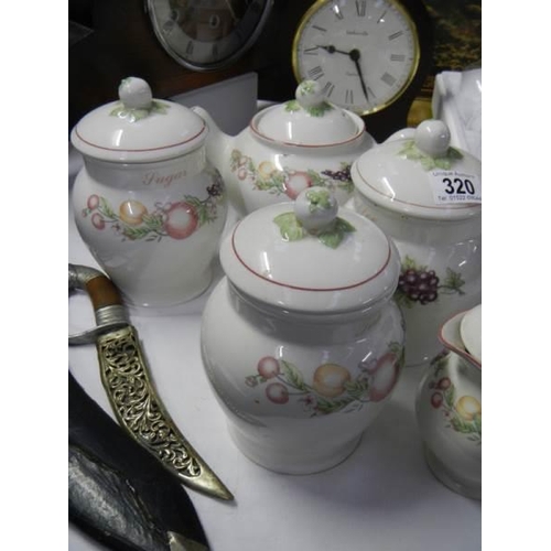 320 - A teapot and quantity of storage jars. COLLECT ONLY.