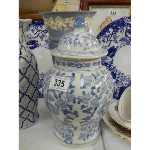 335 - Two blue and white plates, two vases and a lidded jar,. COLLECT ONLY.