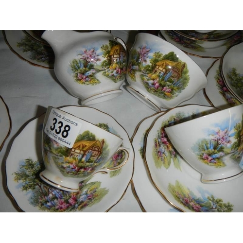 338 - A thatched cottage tea set, COLLECT ONLY.