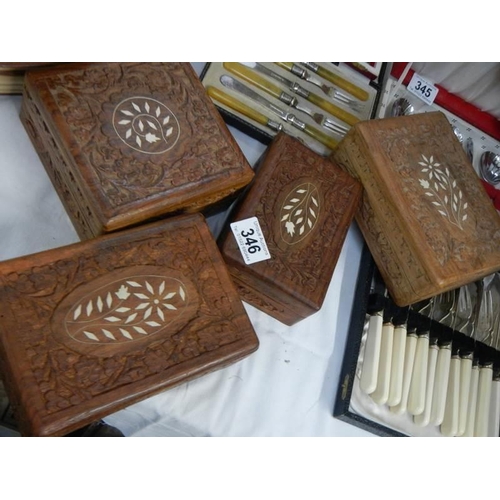 346 - Four carved and inlaid boxes.