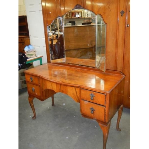 428 - A mahogany bedroom suite comprising triple mirror dressing table and two wardrobes, COLLECT ONLY.