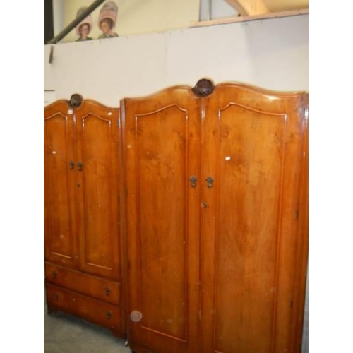 428 - A mahogany bedroom suite comprising triple mirror dressing table and two wardrobes, COLLECT ONLY.