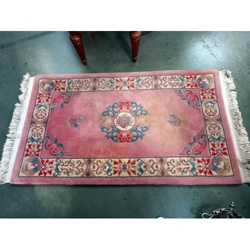 50 - A pink wool rug, COLLECT ONLY.