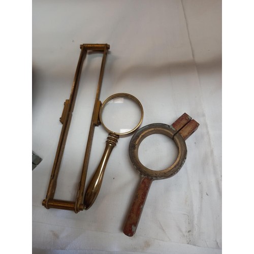 193 - A mixed lot of brass lenses, magnifying glass etc.,