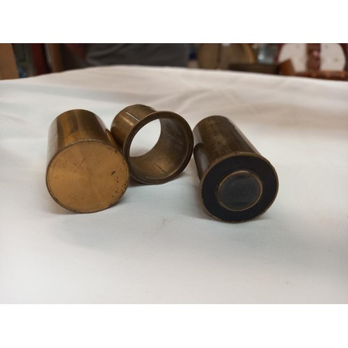 193 - A mixed lot of brass lenses, magnifying glass etc.,