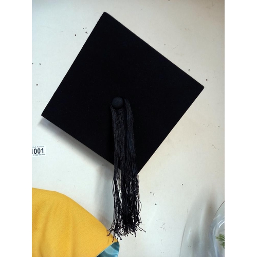 1001 - A boxed mortar board & Graduation gown