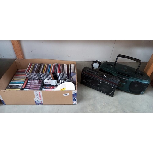 1011 - A Bush CD radio cassette, A Roberts radio alarm & a quantity of CD's & tapes  COLLECT ONLY