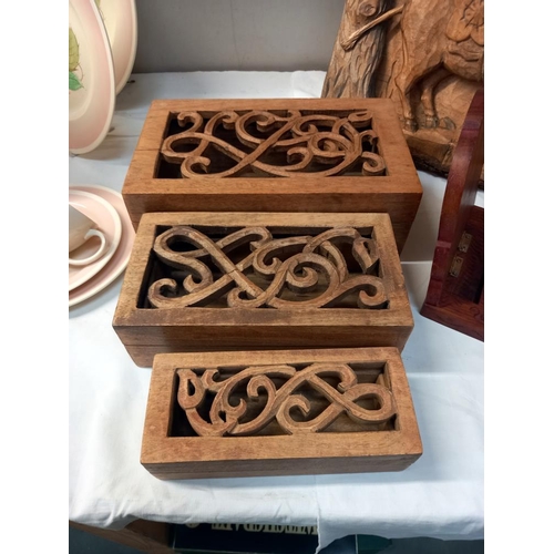 1020 - Three wooden boxes, a wooden book rack & a carved wooden picture COLLECT ONLY