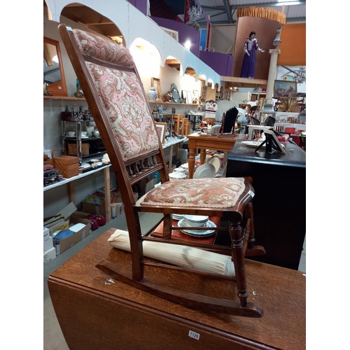 1121 - A rocking chair with part upholstered seat & back COLLECT ONLY