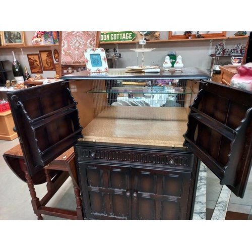 1124 - A 1950's dark oak cocktail cabinet COLLECT ONLY