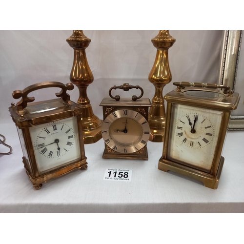 1158 - A pair of Victorian brass candlesticks & a Finnigans Paris carriage clock (overwound) & 2 others COL... 