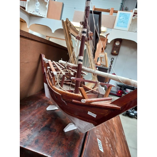 1250 - A wooden model of a boat COLLECT ONLY.