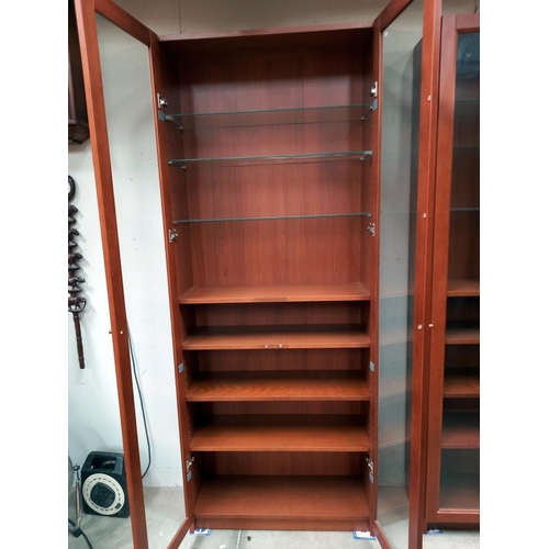 1120A - 2 mahogany effect 2 door book cases/display cabinets COLLECT ONLY