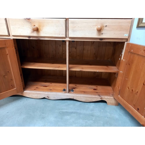 1265 - A three door pine dresser, COLLECT ONLY.